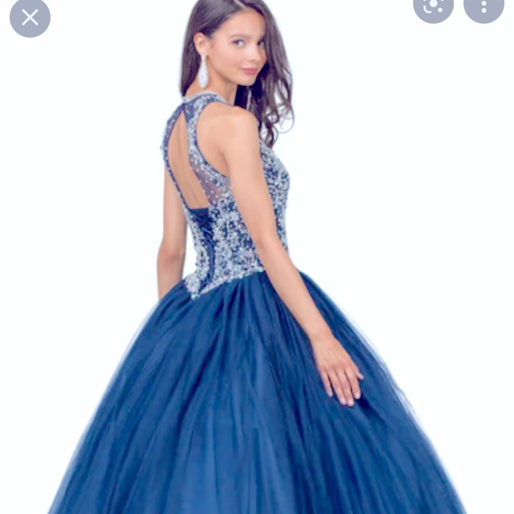 I have this navy blue Quinceañera Dress, new still with tag in Size 2x